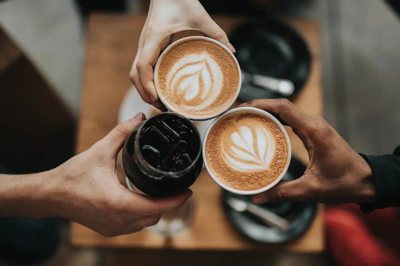 A flat white with latte art on a Bree Street café table